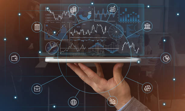 istock Hand holds tablet with graphs and symbols 1221345213