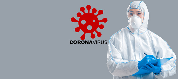 COVID-19 quarantine. Asian doctor wearing protective suit on grey background, collage with bacteria and word CORONAVIRUS. Panorama