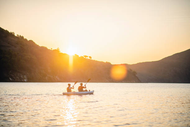 istock Spanish Kayakers Paddling in Mediterranean at Sunrise 1221345536