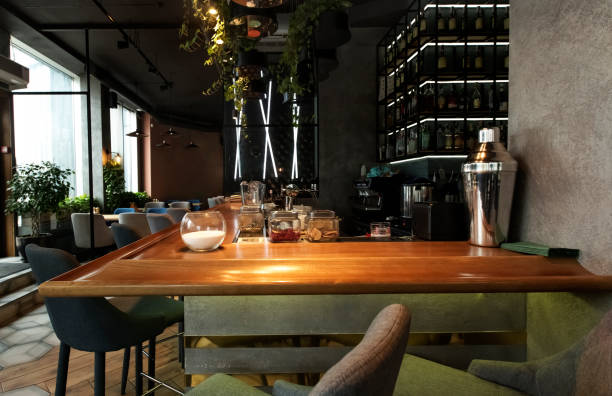 istock Interior of a modern urban restaurant with half-lighted bar 1221345647