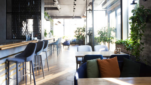istock Light modern interior of urban restaurant or cafe with dining places 1221346562