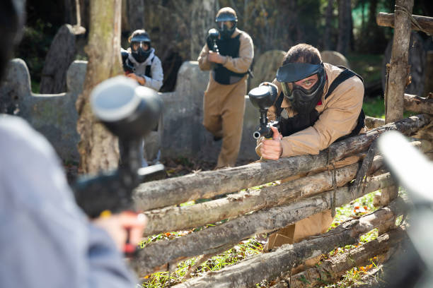istock Men and women playing paintball 1221347457