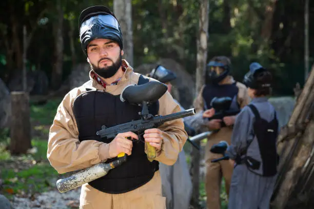 Photo of Male paintball player ready for game