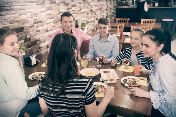 istock Big family in cafe 1221347540