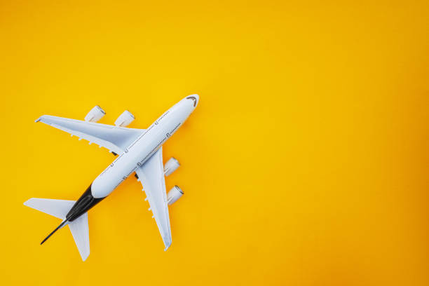 istock Sky airplane isolated on yellow background 1221347651