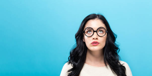 istock Young woman looking upward 1221348177