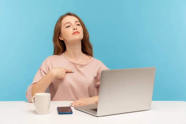 This is me! Egoistic selfish employee woman pointing herself and looking with arrogant self-confident expression