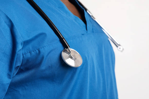 istock Stethoscope on black doctor chest, close up 1221350190