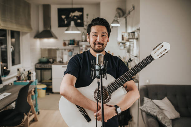 istock Japanese man and his guitar 1221351459