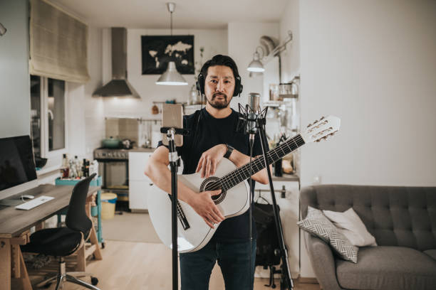 istock Portrait of a guitar player at home studio 1221351678