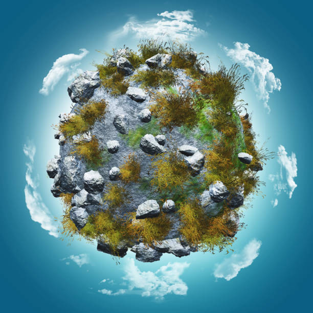 istock 3D globe with rocks and grasses on a blue sky with clouds 1221353017