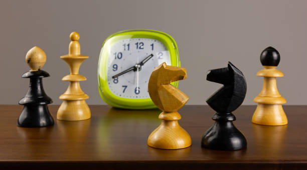 istock Two Knights Facing Each Other and Other Chess Pieces 1221354729