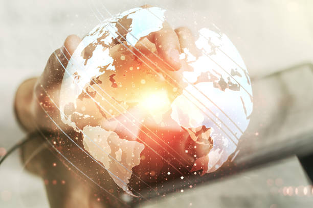 istock Multi exposure of abstract graphic world map and hand working with a digital tablet on background, connection and communication concept 1221358409