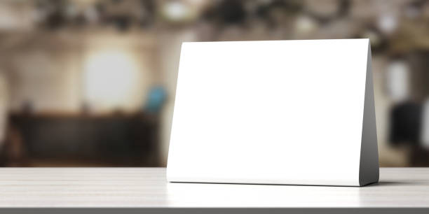 istock Table tent, reserved card sign empty blank on a wooden table, 3d illustration 1221361019