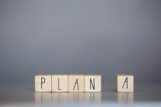 istock Wooden cube with PLAN A text on grey background. Goals, success, strategy, solution and business concepts 1221364357
