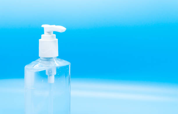 istock Clear hand sanitizer jel isolated on a blue background. 1221366854