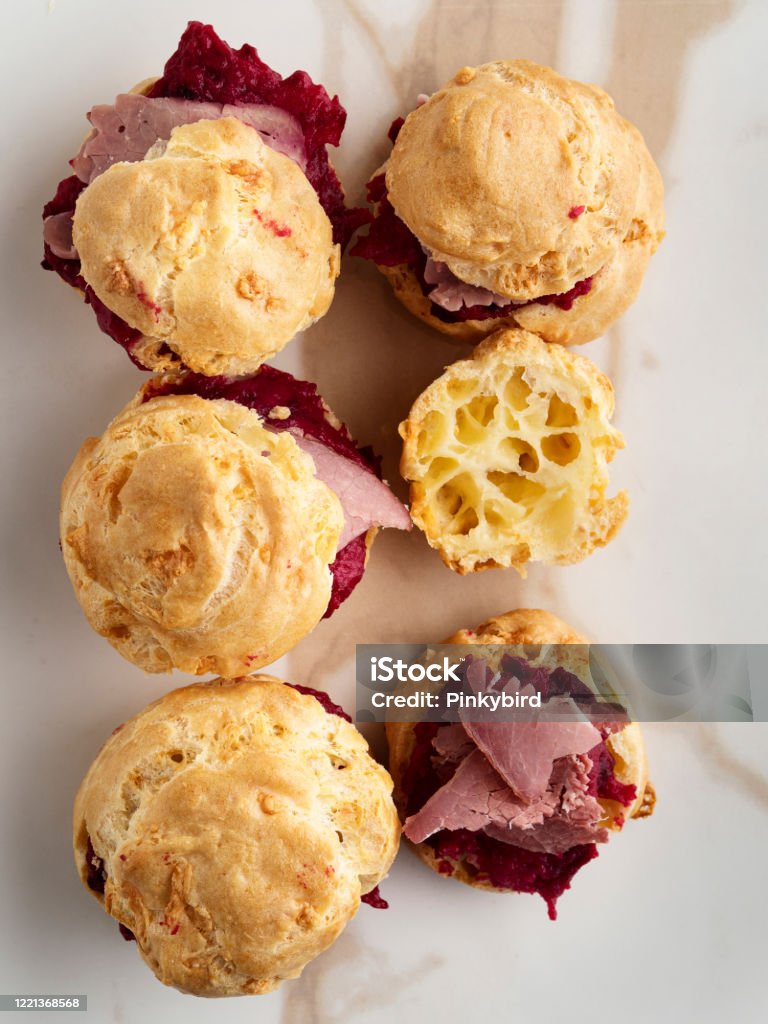Savory Pate a Choux (Savory Puffs) with Smoked meat, Choux pastry with meat, french cheese choux, French snack gougere buns with cheese and meat France, Italy, Baked, Baked Pastry Item, Choux Pastry, meat, Profiterole, Salted, Appetizer, Backgrounds, food, Bun - Bread,  Biscuit, cake, Beet Stock Photo
