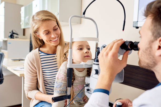 istock Little Girl Visiting Optometrist 1221368723