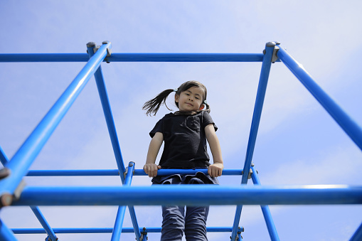 Japanese girl on the jungle gym (5 years old)