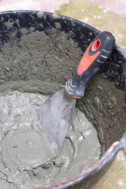 istock Bucket with cement mortar or industrial glue 1221371350