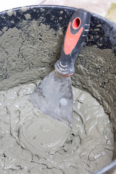 istock Bucket with cement mortar or industrial glue 1221371460