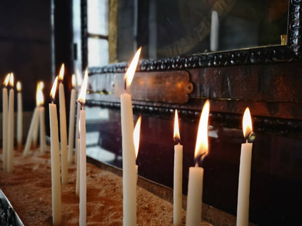 istock Candles in front of religious altar 1221374320