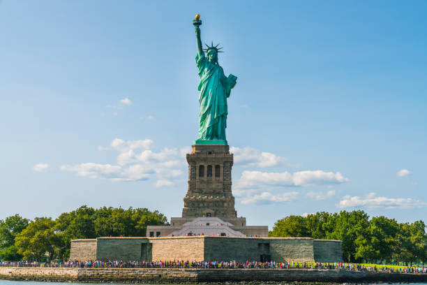 istock The statue of Liberty  with blue sky background. 1221375028
