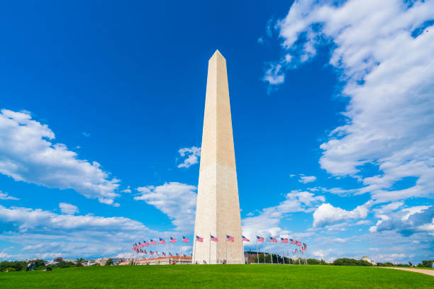 istock washington dc,Washington monument on sunny day with blue sky background. 1221375892