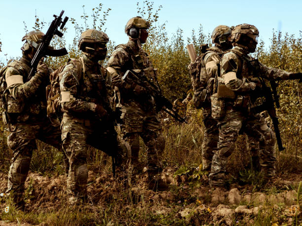 istock Military swat team members during operation. 1221377535