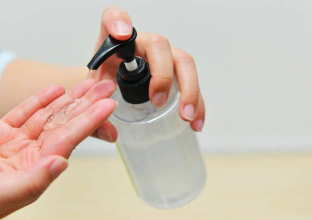 istock Doctor washing hand with Alcohol Sanitizer 1221377959