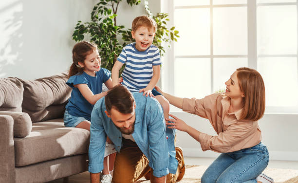 istock Happy family having fun at home 1221377991