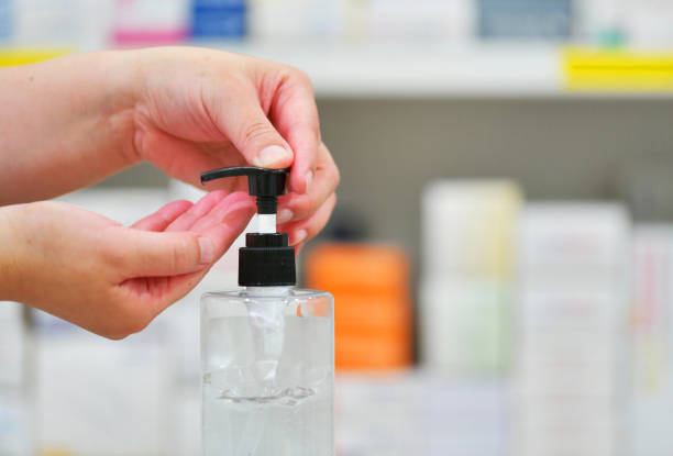 istock Pharmacist washing hand with Alcohol Sanitizer 1221378243