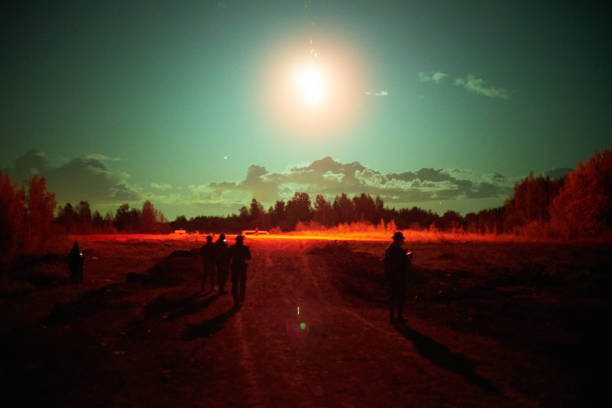 istock Military operations at night. Emergency flare. Signal rocket. 1221378355