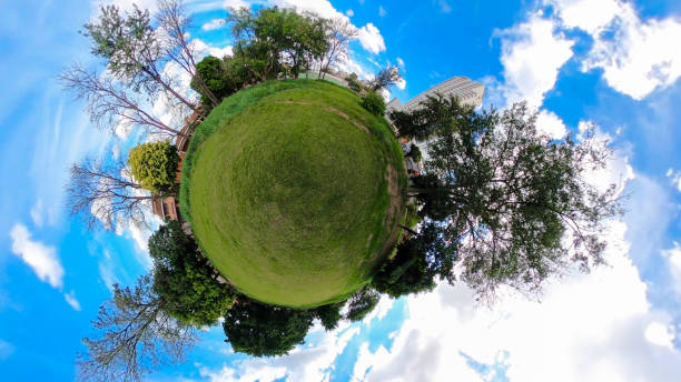 istock Mini world background with grass, three and houses 1221379832