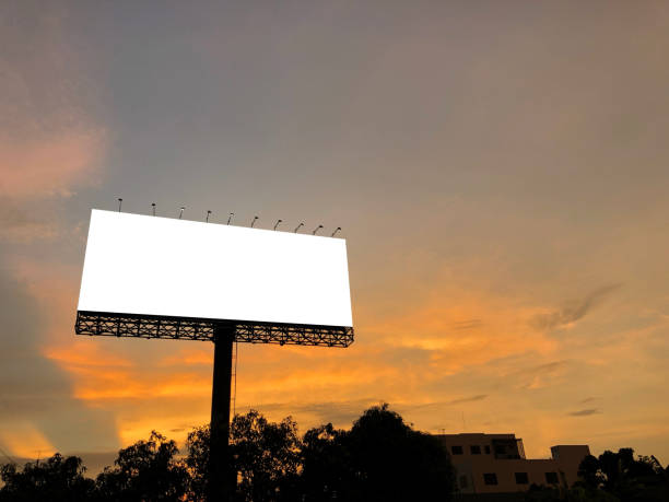 istock Blank billboard for design work, outdoor advertising at night time 1221381430