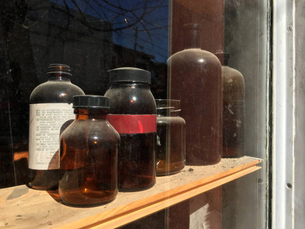 istock Brown antique jars over wooden shelf 1221381786