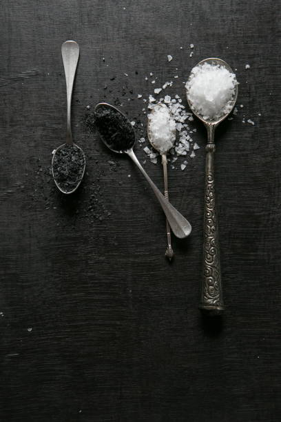 istock black and white salt on silver spoons 1221383395