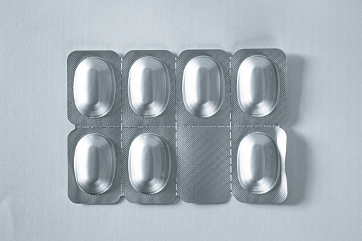 Pill blister pack on gray.