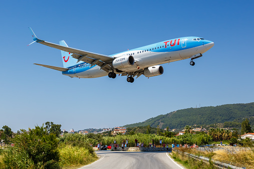 Skiathos, Greece – July 29, 2019: TUI Boeing 737-800 airplane at Skiathos airport (JSI) in Greece. Boeing is an American aircraft manufacturer headquartered in Chicago.