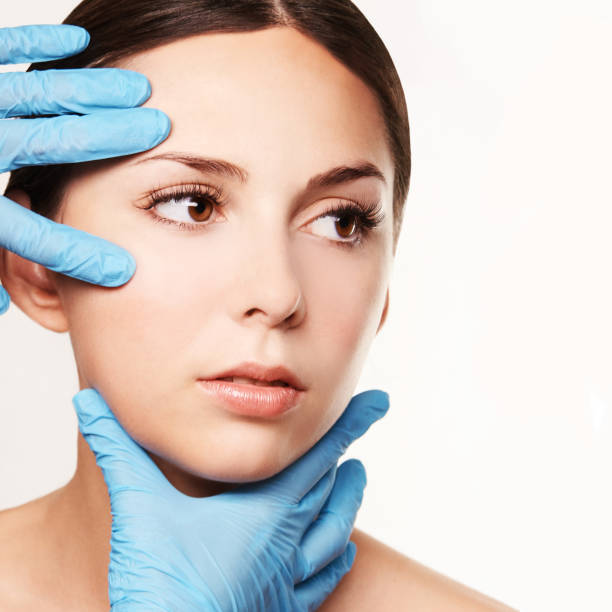 facelift hydra treats. esthetic skin care analysis. doctor hands in gloves. - lifting device imagens e fotografias de stock