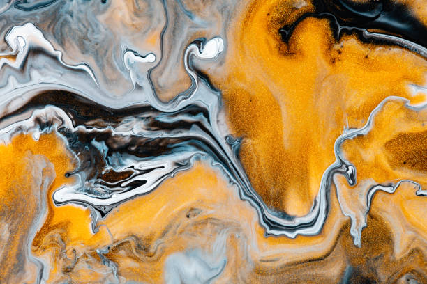 istock Fluid art texture. Abstract background with iridescent paint effect. Liquid acrylic artwork that flows and splashes. Mixed paints for background or poster. Golden, black and blue overflowing colors. 1221386835