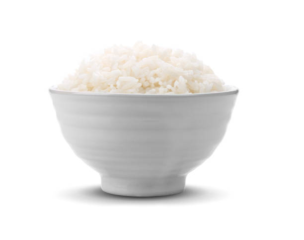 istock rice in white bowl on white background 1221387235
