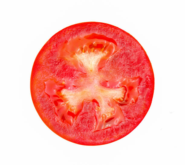 istock Slice of tomato isolated on white background 1221387253