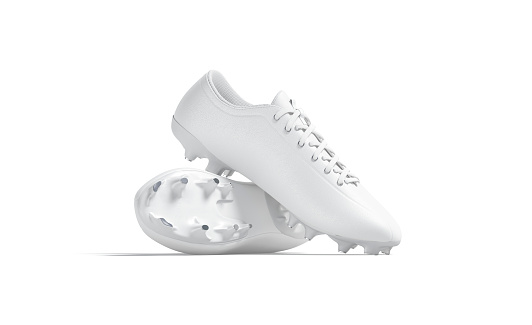 Botas de fútbol blancas en blanco con tacos de goma pila de maquetas, aislado photo