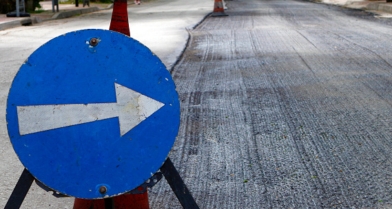 Repair of asphalt road - Detour on the road. Traffic signs
