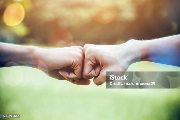 Hands Of Two Man People Fist Bump Team Teamwork And Partnership Business Success Volunteer Charity Work People Joining For Cooperation Mergers And Acquisitions Concept Stock Photo - Download Image Now