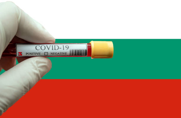 Positive COVID-19 blood test tube with Flag of Bulgaria at background. COVID-19 Pandemic Coronavirus concept ; Close-up of a Positive COVID-19 blood test sample tube with Flag of Bulgaria  at background. Blood testing for diagnosis new Corona virus infection bulgarian culture photos stock pictures, royalty-free photos & images