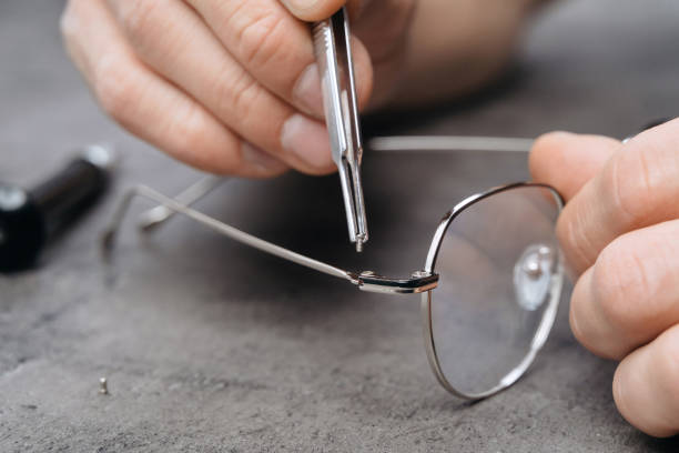 istock Fixing of eyeglasses frame in optician office 1221393551