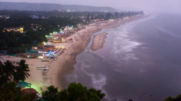 Beautiful view to Goa beach from high.  Sunset at Arambol. Goa, India. Beautiful view to Goa beach from high.  Sunset at Arambol. Goa, India. goa beach party stock pictures, royalty-free photos & images