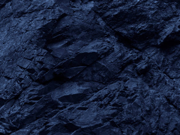 istock Dark blue rock background. Toned mountain texture. Close-up. 1221395599